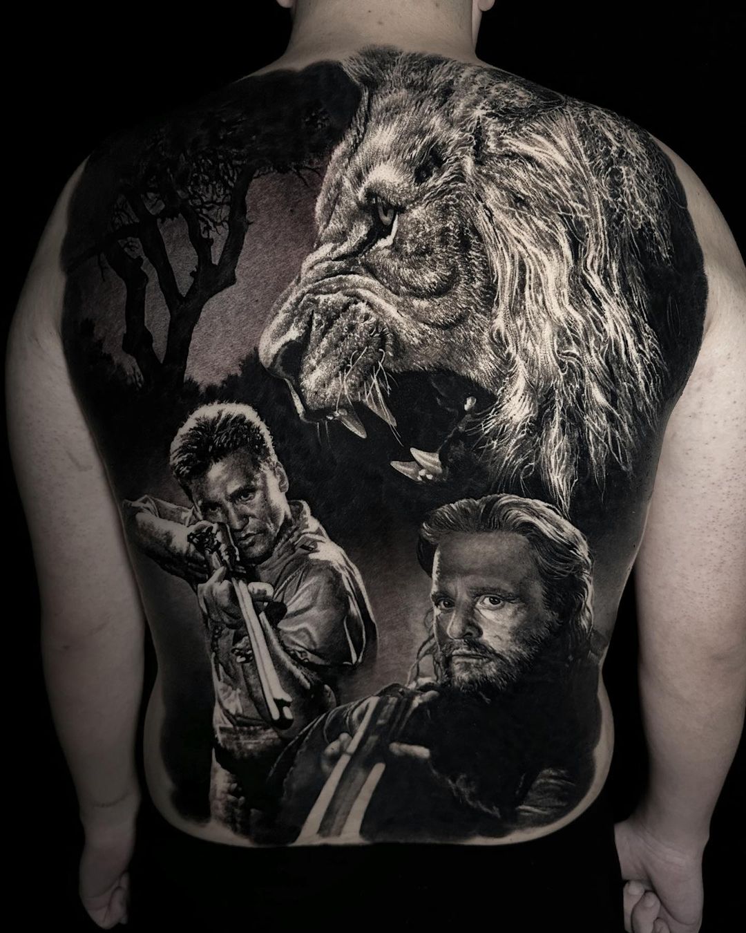 black and grey realism tattoo on back