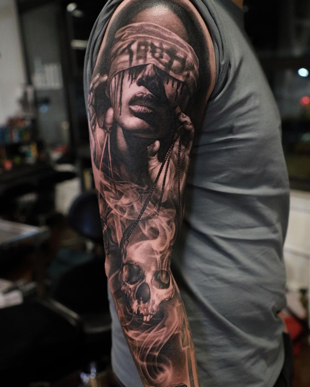 black and grey realism tattoo sleeve for man
