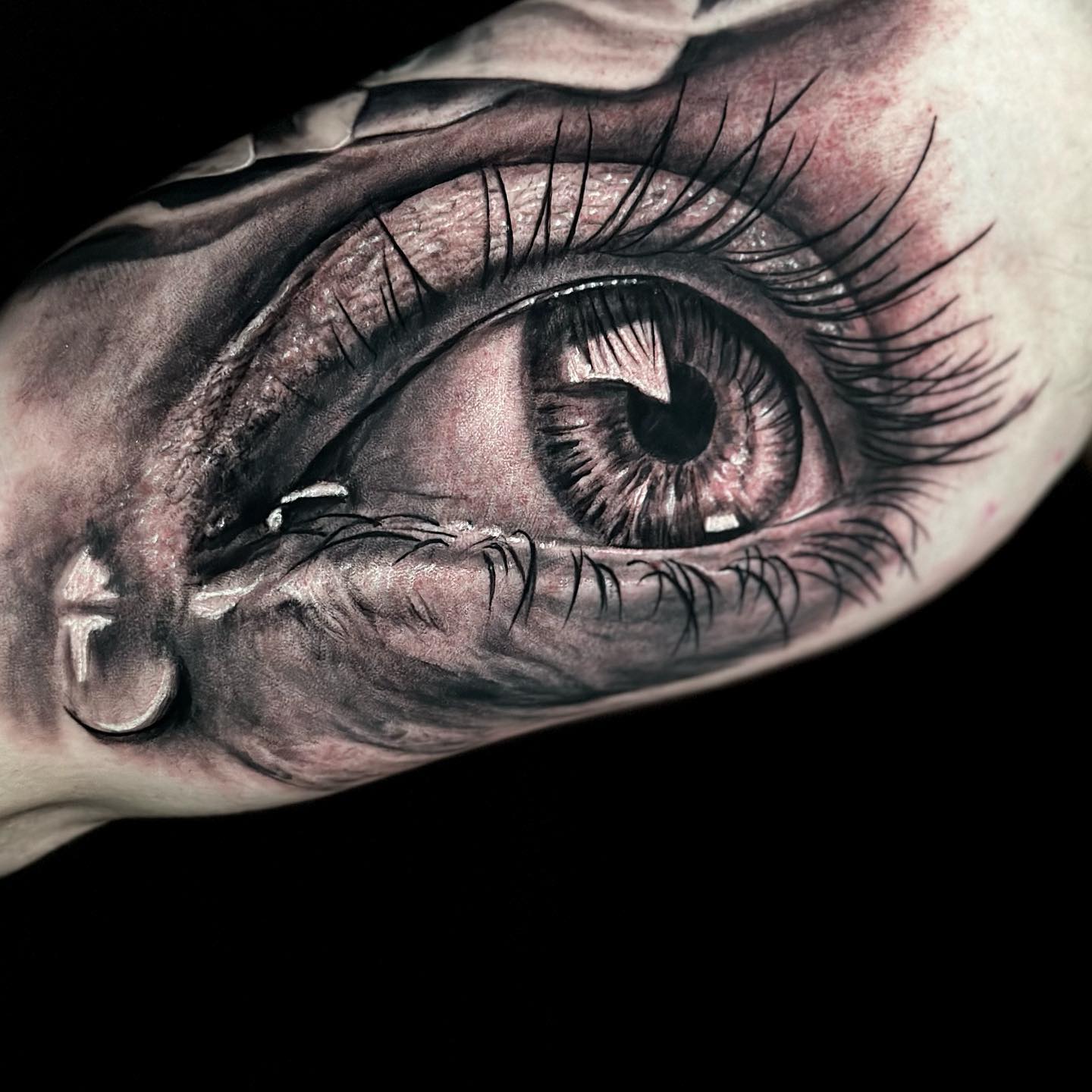 black realistic eye tattoo design