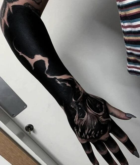 blackwork hand tattoo