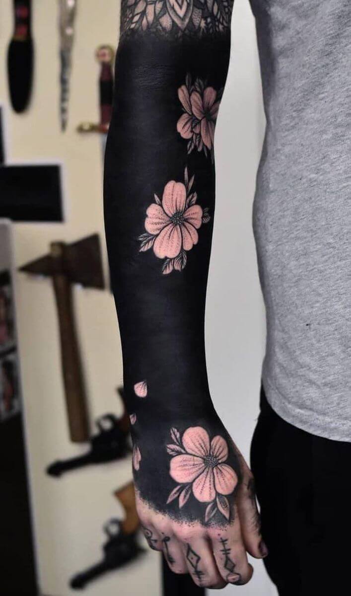 blackwork tattoo sleeve with flowers