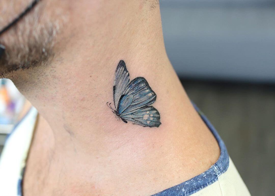 blue butterfly neck tattoo 1