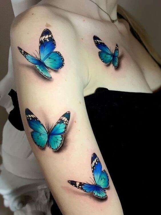 blue butterfly tattoo arm