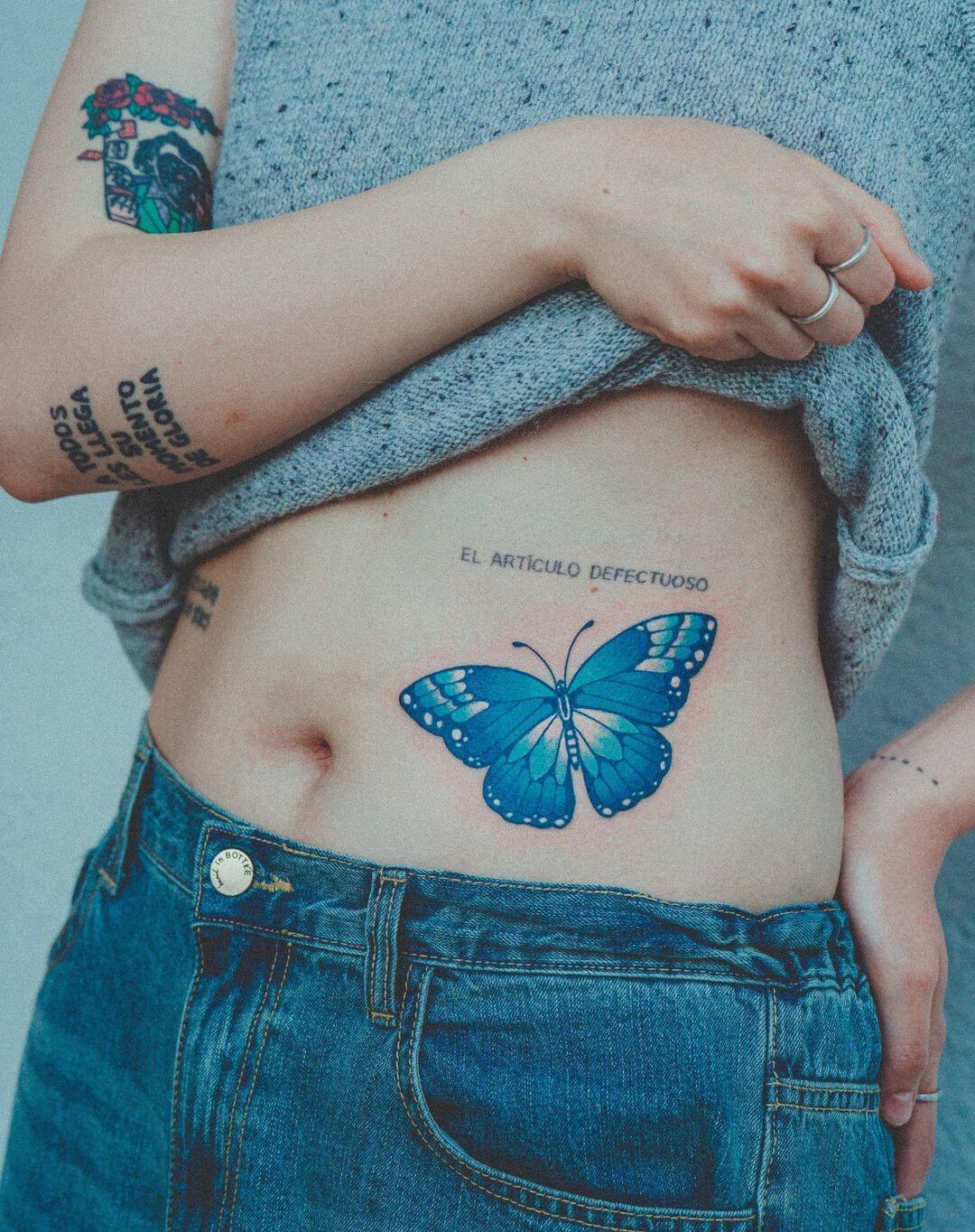 blue butterfly tattoo meaning on a woman