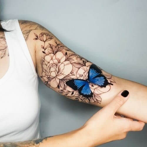 blue butterfly tattoo on hand