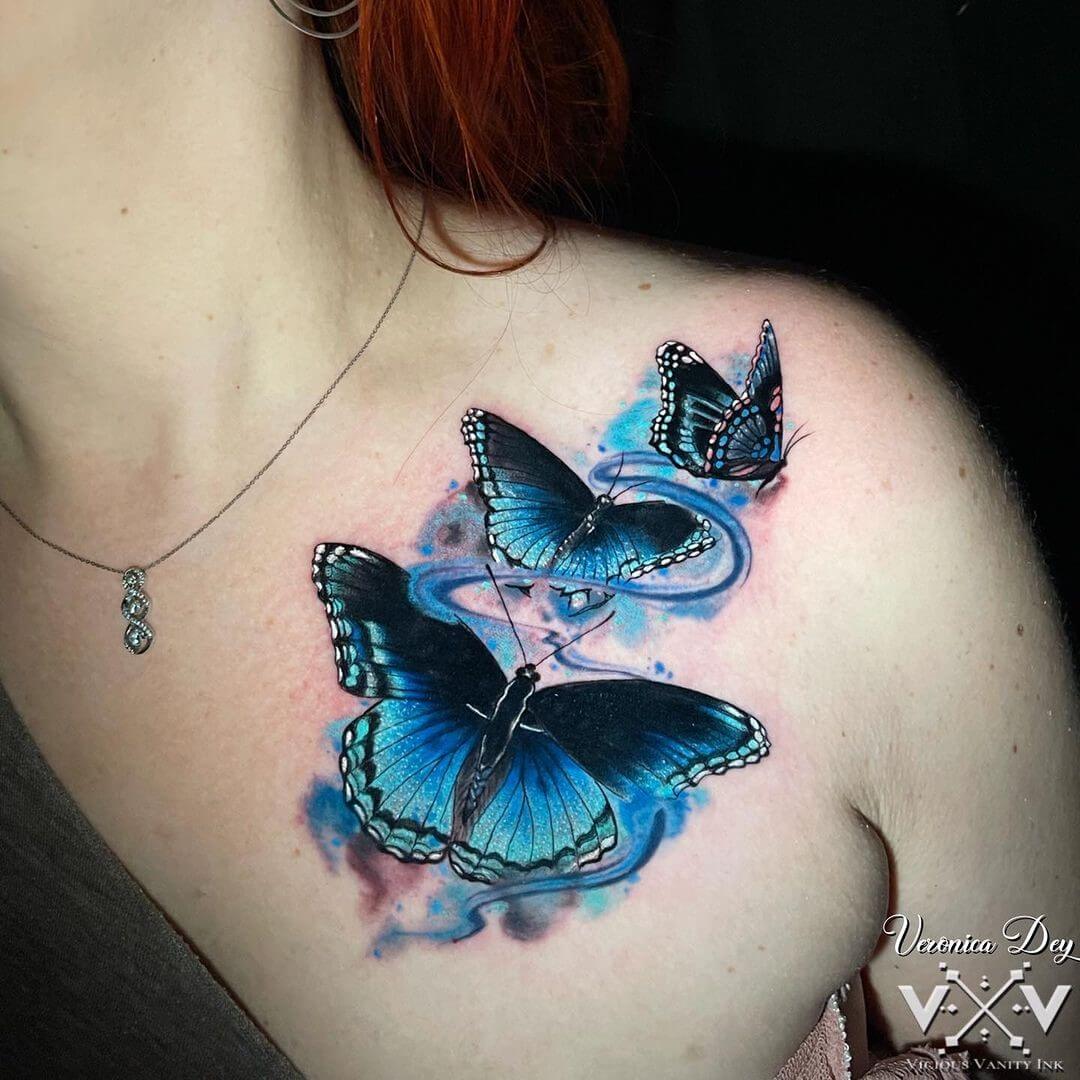 blue butterfly tattoo on the shoulder