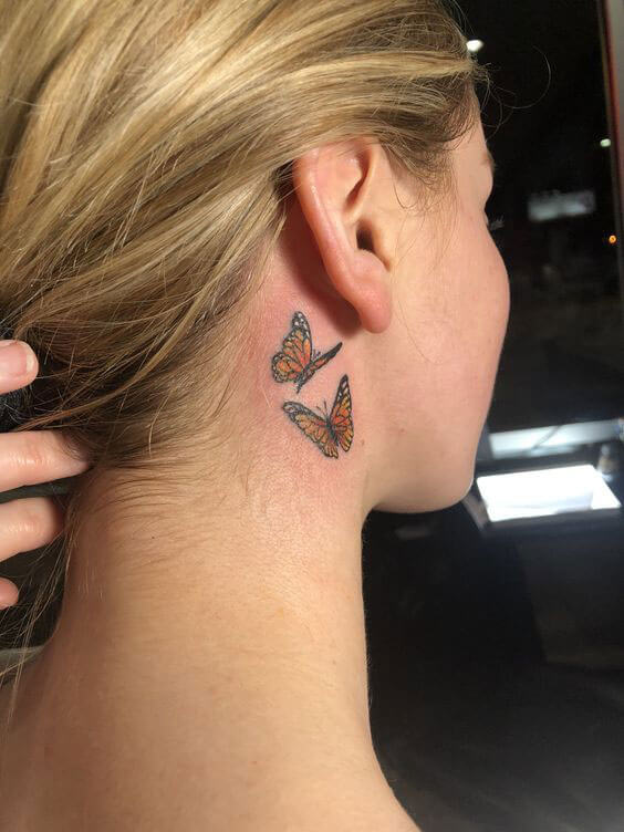 butterfly tattoo on the neck