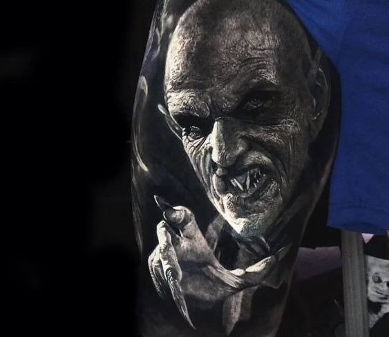 black and grey realistic tattoo horror