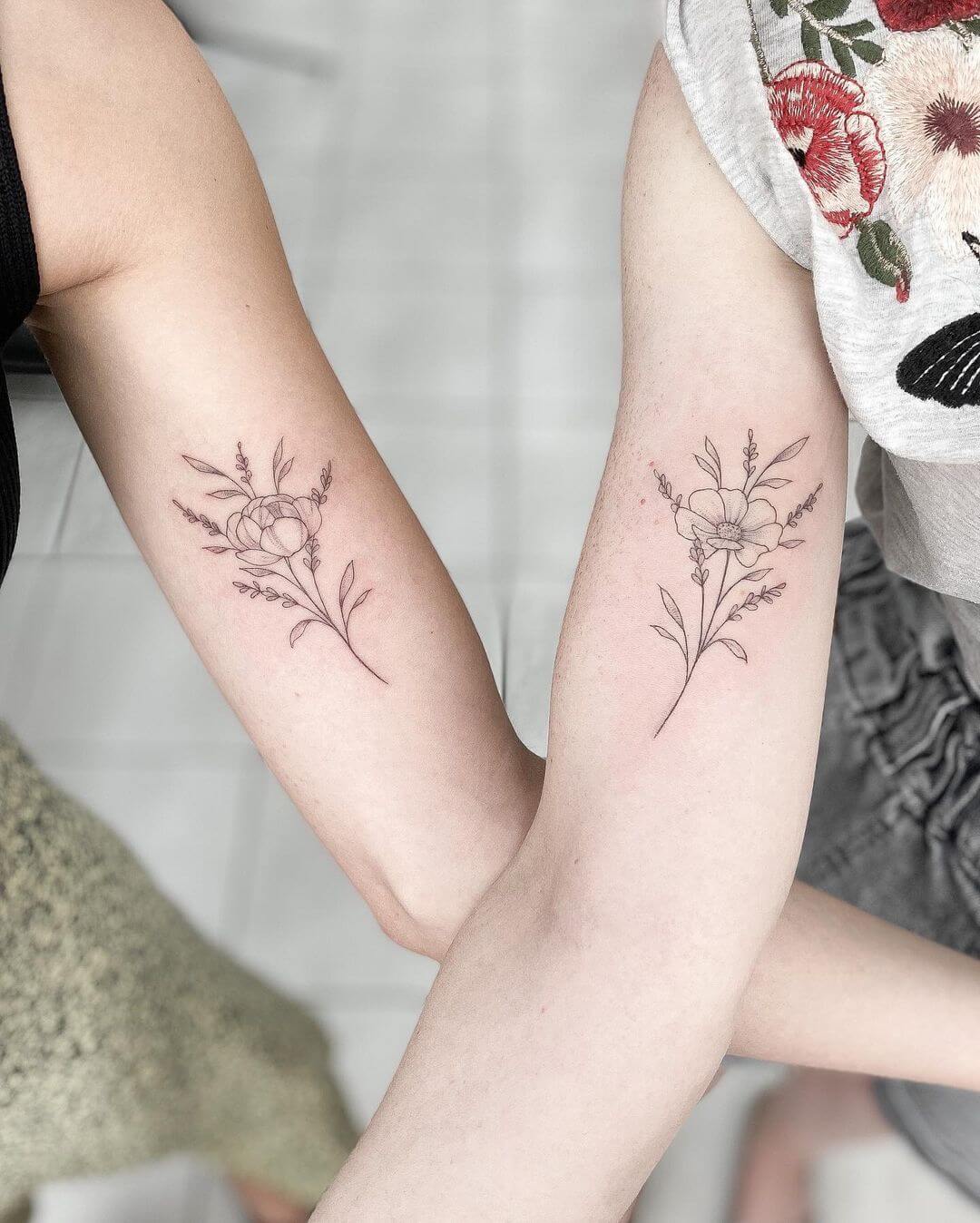 fine line flower bouquet tattoo.