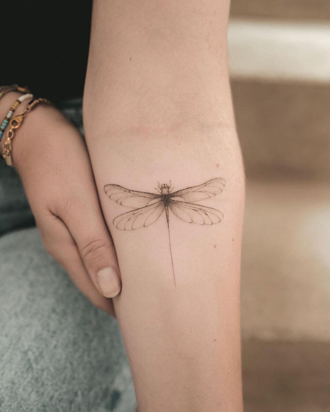 fine line tattoo dragonfly.