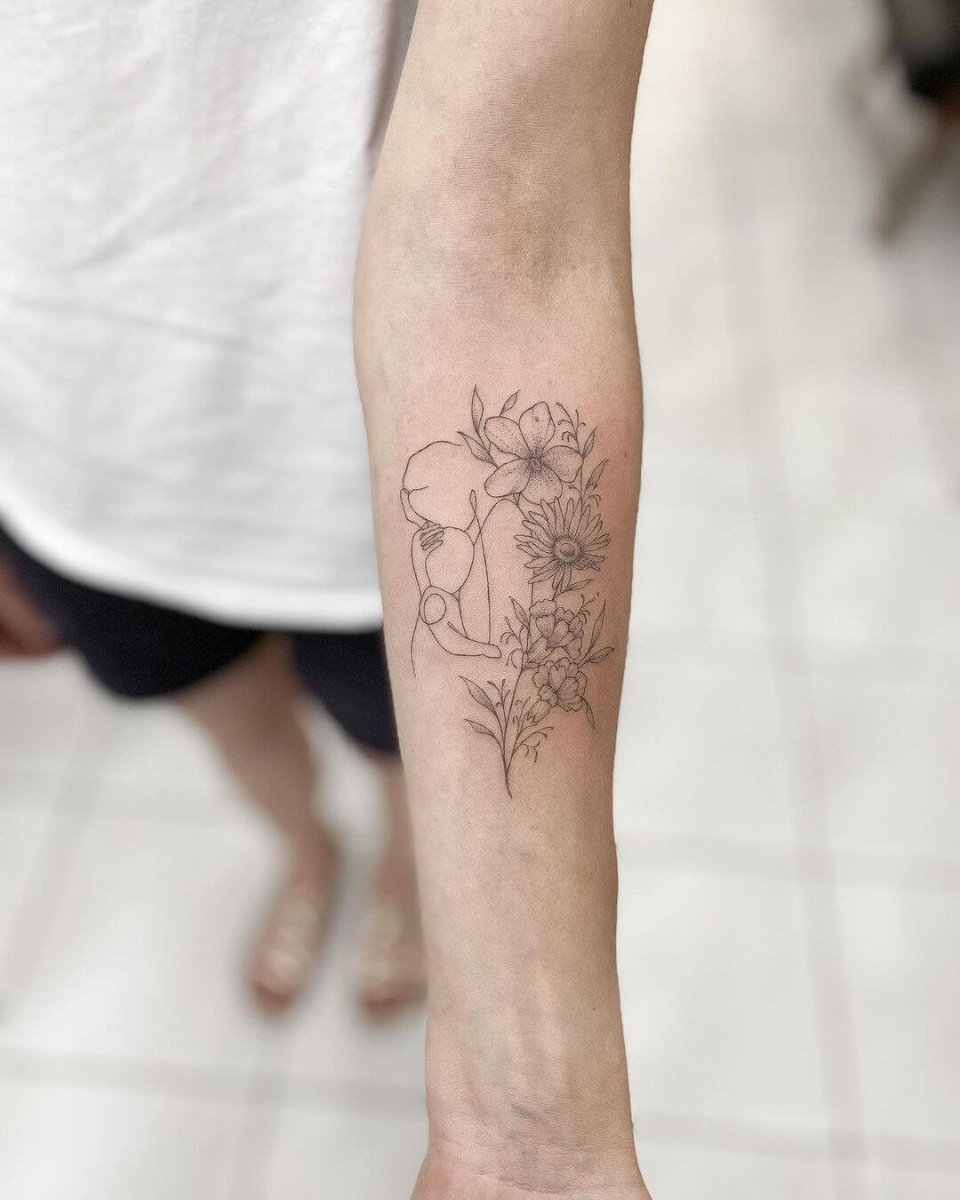 fine line tattoo flower.
