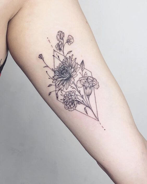 geometric capricorn flower tattoo