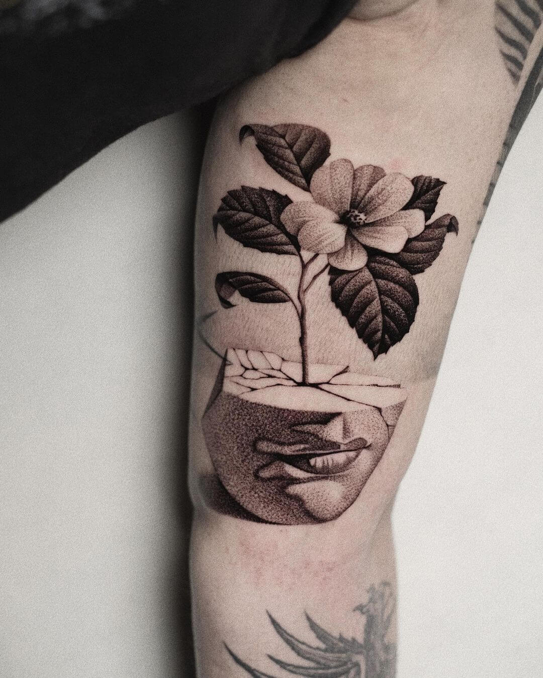 minimalist surrealism tattoo flower