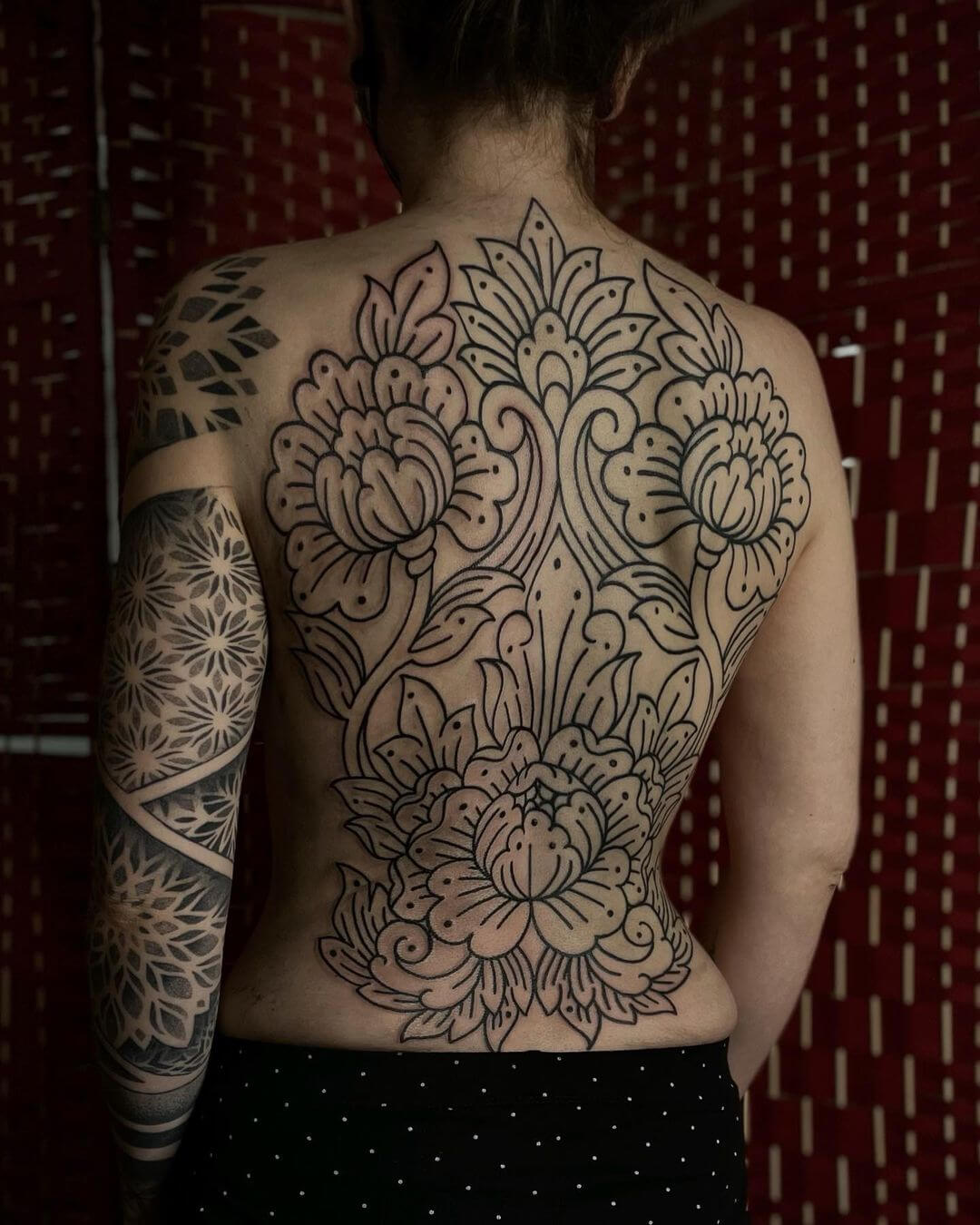 ornamental back tattoo for women