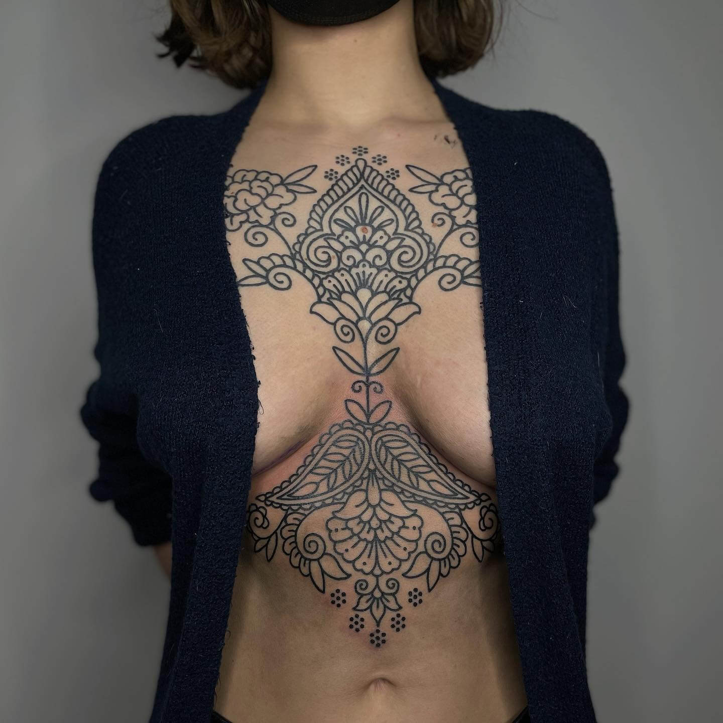ornamental chest tattoo women
