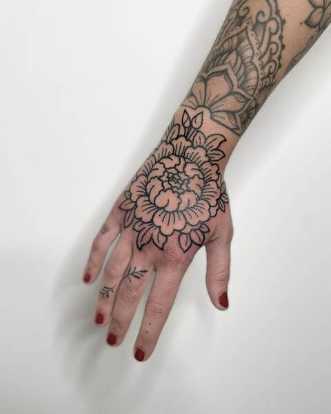 ornamental hand tattoo women