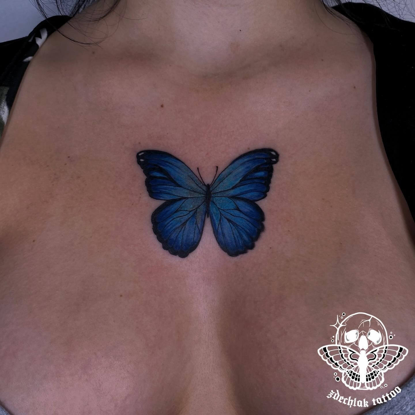 small blue butterfly tattoo