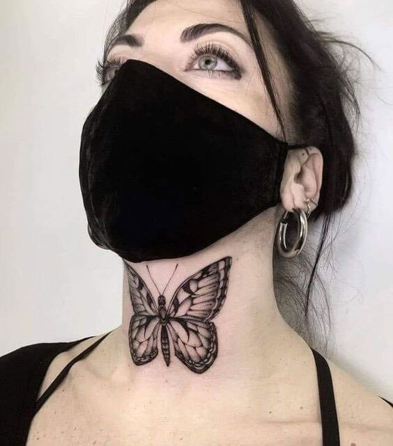 small butterfly tattoo on neck