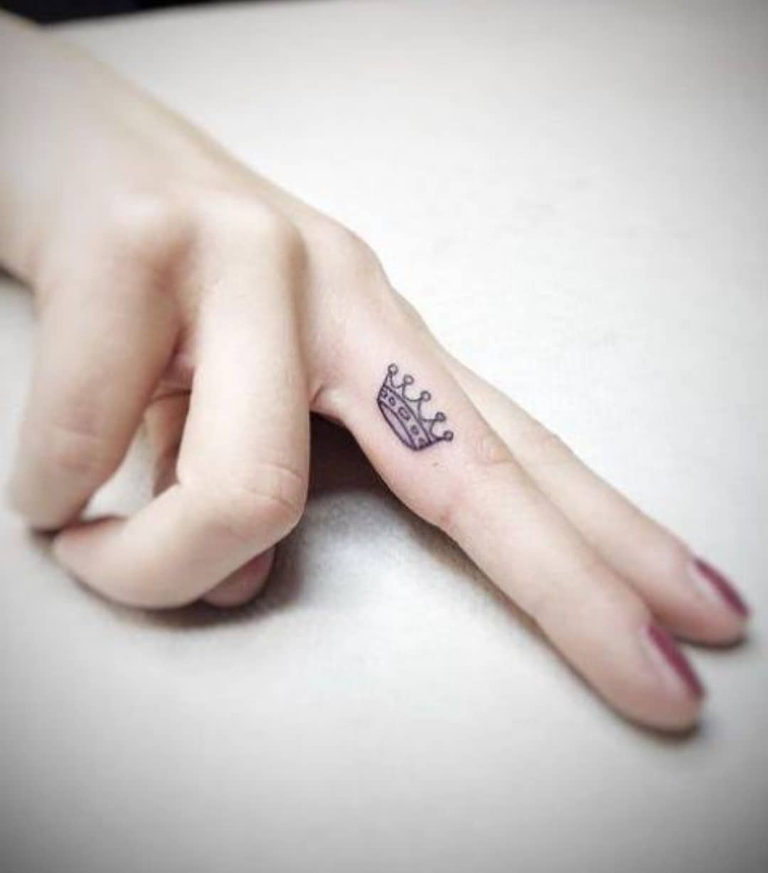 Black King And Queen Crown Tattoo On Couple Finger
