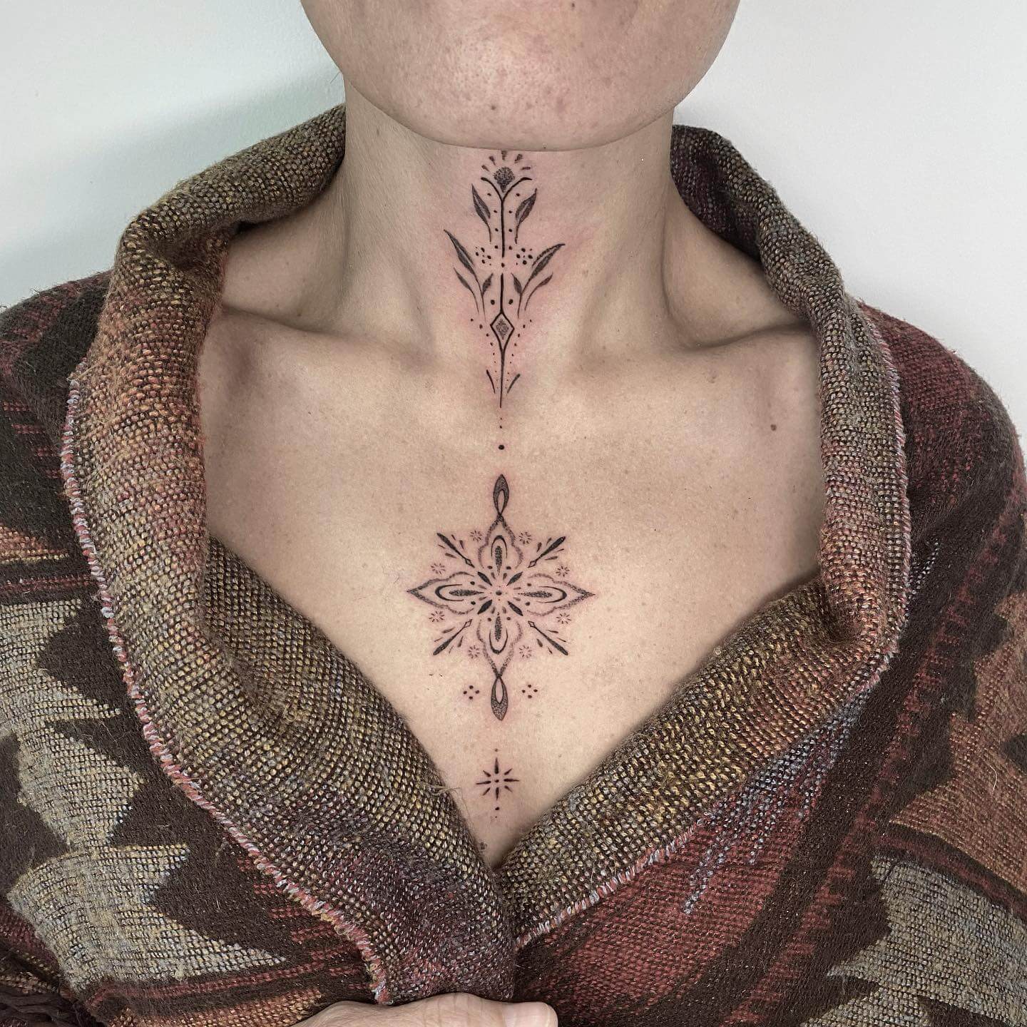 Floral tattoo on a collarbone - Tattoogrid.net
