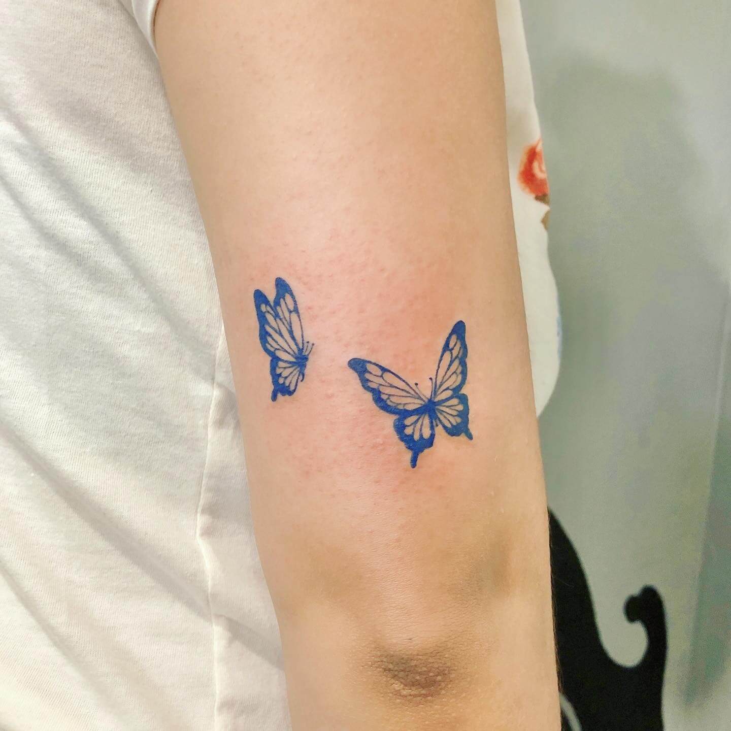 tiny blue butterfly tattoo