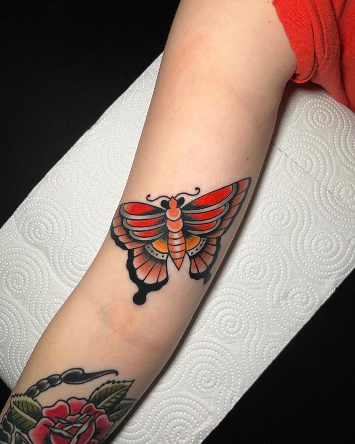 traditional butterfly hand tattoo