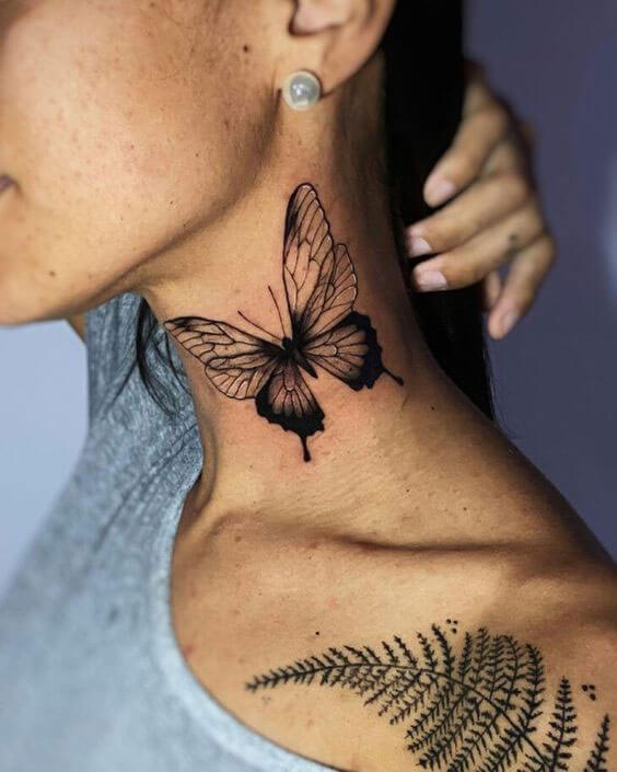 woman butterfly tattoo on side neck